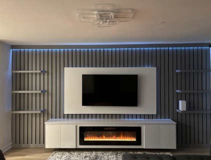 Contemporary TV unit with built-in electric fireplace, LED accent lighting, and vertical slat design for a modern look.
